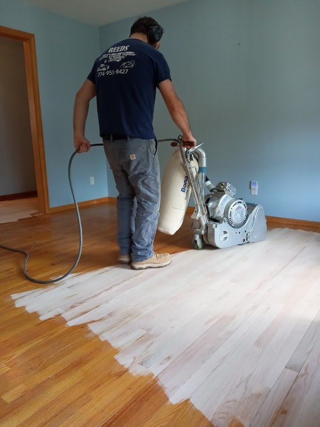 Wood flooring with updated stain tone after refinishing